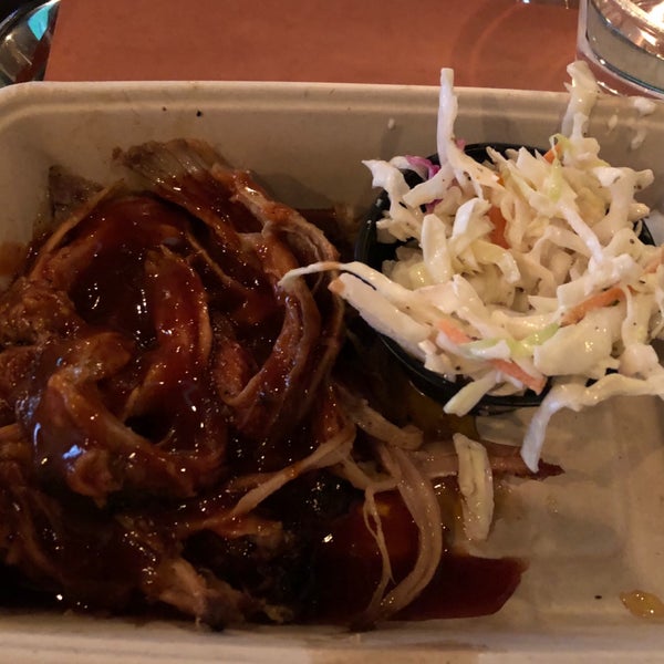 Photo taken at Mighty Quinn&#39;s BBQ by Elizabeth F. on 8/12/2019