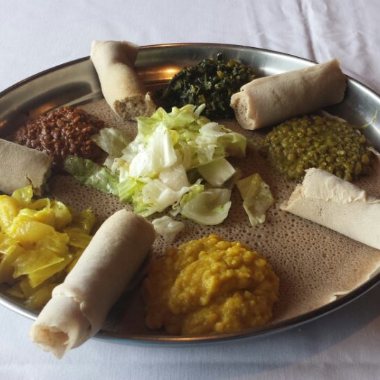 Photo taken at Lucy Ethiopian Restaurant &amp; Lounge by Iztok U. on 4/22/2014