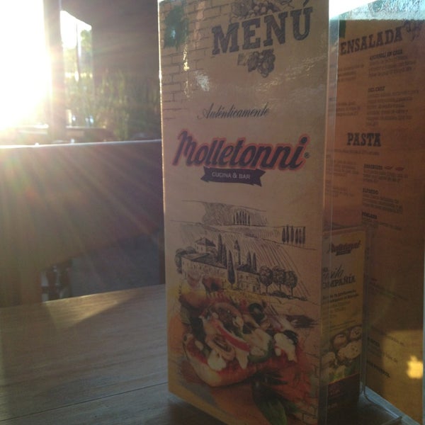 Photo taken at Molletonni Cucina &amp; Bar by Cesar E. on 12/22/2012