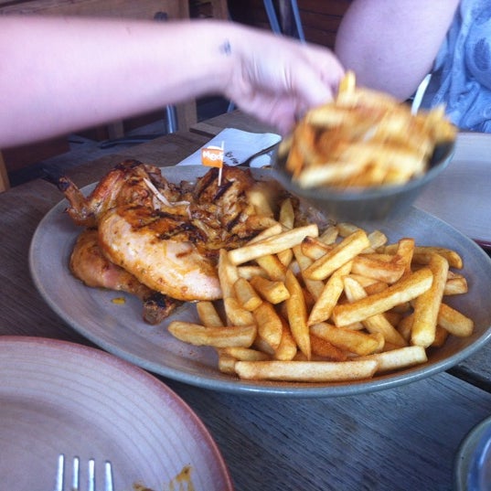 Photo taken at Nando&#39;s by Paul S. on 8/10/2012