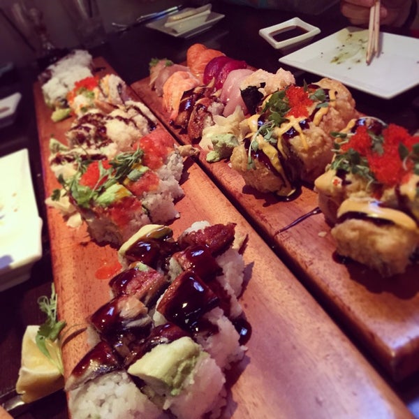 Photo taken at Okura Robata Sushi Bar and Grill by Matthew P. on 11/12/2014