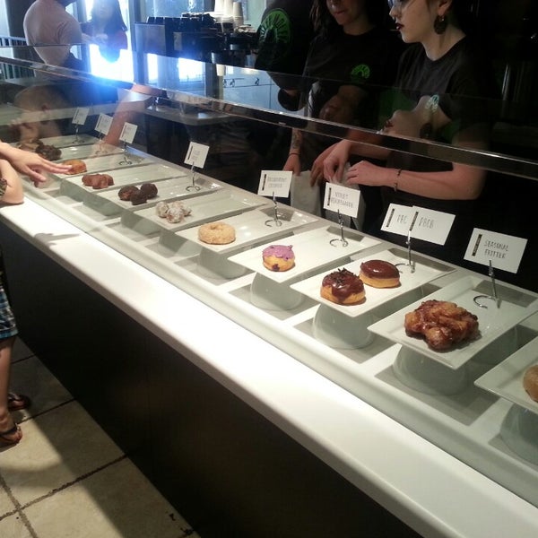 Photo taken at Holey Moley Coffee + Doughnuts by Ashley N. on 7/19/2014