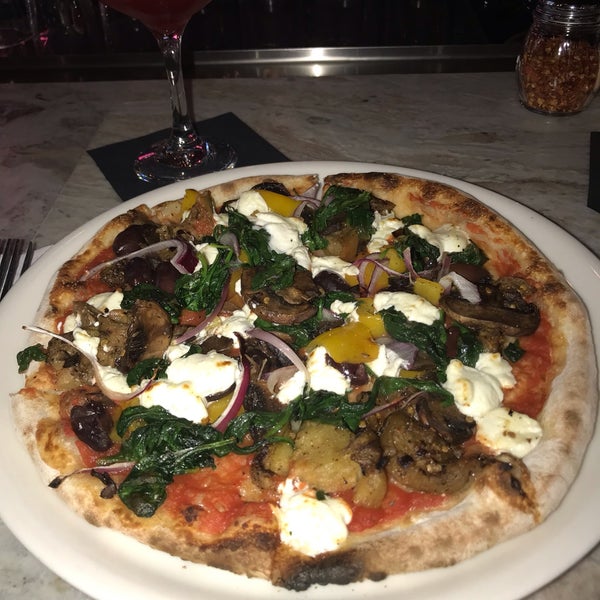 Photo taken at Ella&#39;s Wood-Fired Pizza by Tanya Mitchell G. on 3/9/2019