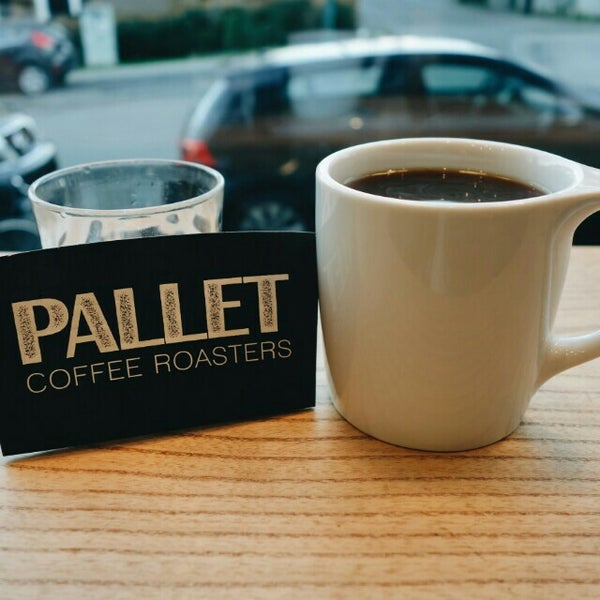 Photo taken at Pallet Coffee Roasters by Jackie W. on 12/31/2015