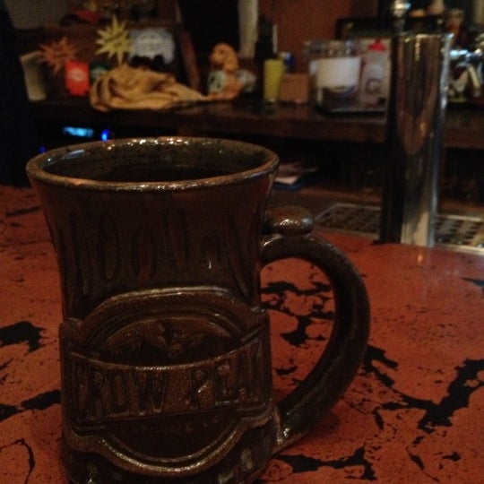 Photo taken at Crow Peak Brewing Company by Michelle @. on 12/12/2012