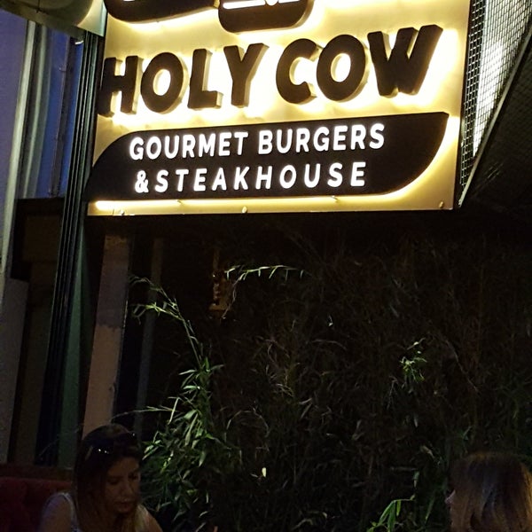 Photo taken at Holy Cow Gourmet Burgers &amp; Steakhouse by Oytun P. on 6/14/2017