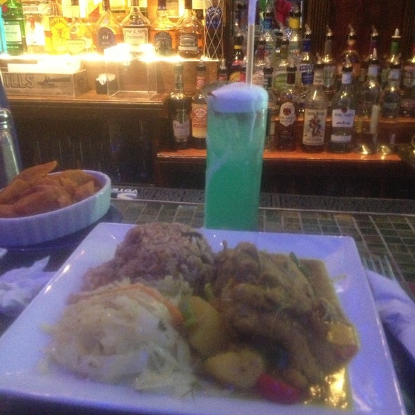 Photo taken at Reef Caribbean Restaurant And Lounge by Eleise C. on 6/21/2014