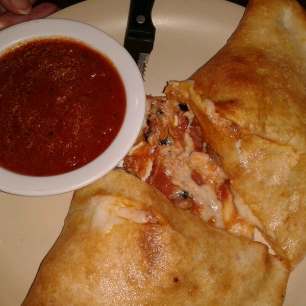 Mom loves the Supreme Calzone minus peppers and sausage.