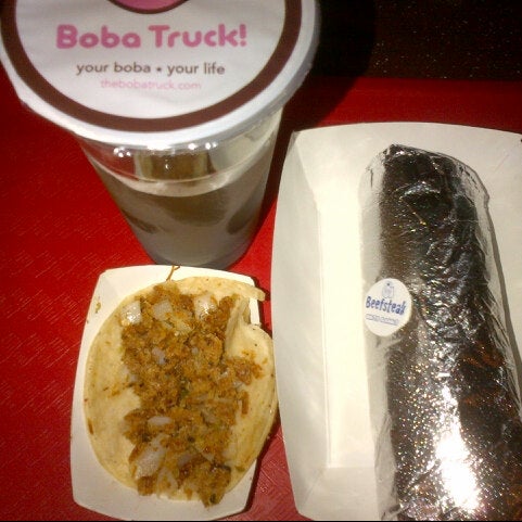 Photo taken at White Rabbit Fusion Cafe/Boba Truck Cafe by TiO on 11/14/2012