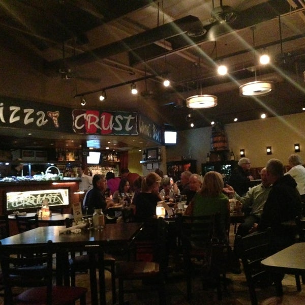 Photo taken at Crust Pizza &amp; Wine Cafe by Scott A. on 1/19/2013