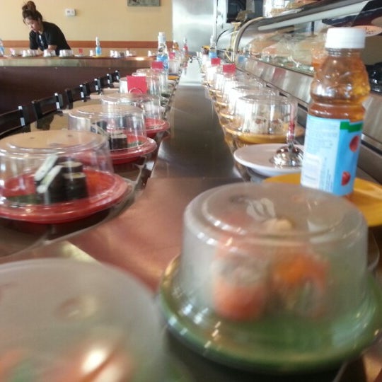 Photo taken at KiKu Revolving Sushi by Steven on 12/27/2012