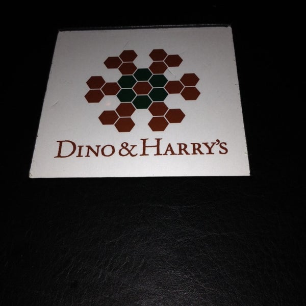 Photo taken at Dino &amp; Harrys Steakhouse by Gabriella G. on 11/10/2013