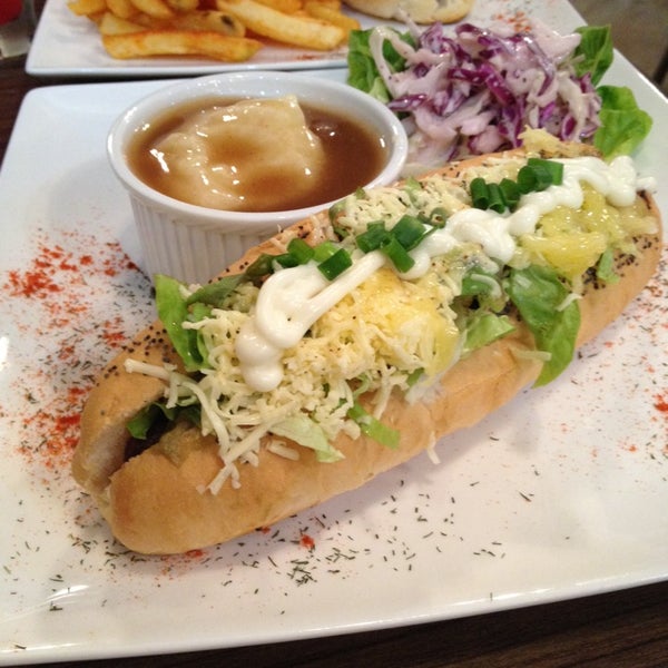 Photo taken at Gourmet Hotdog Cafe by Mong Yen T. on 10/26/2013