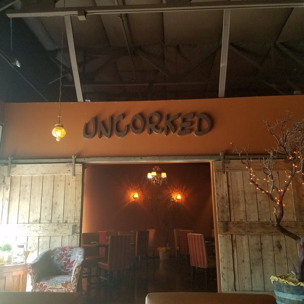 Photo taken at Uncorked Wine Bar &amp; Bistro by Stacy on 7/21/2018