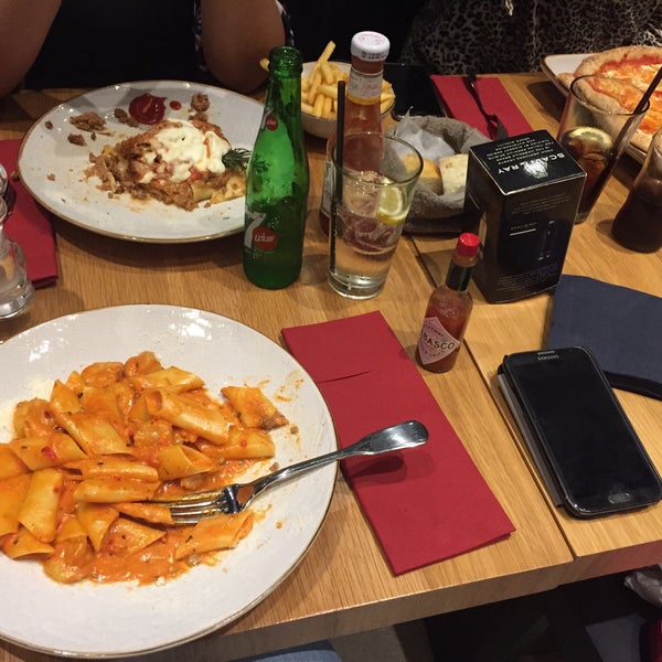 Photo taken at OBICÀ Mozzarella Bar &amp; Pizza E Cucina by RT on 3/21/2015