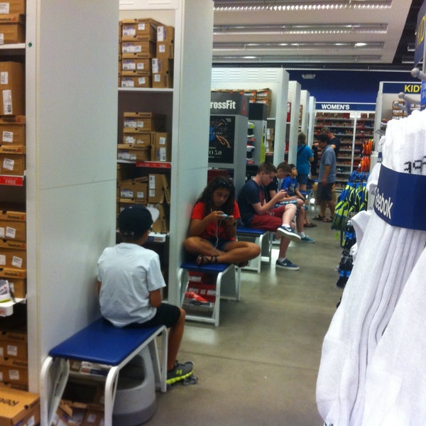Photo taken at Reebok Outlet by Libby J. on 7/18/2015
