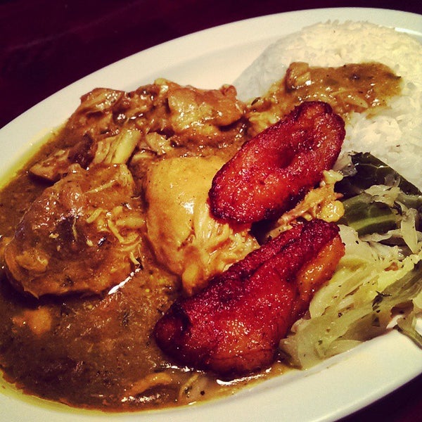 Photo taken at Mangos Caribbean Restaurant by TeLisa D. on 10/12/2014