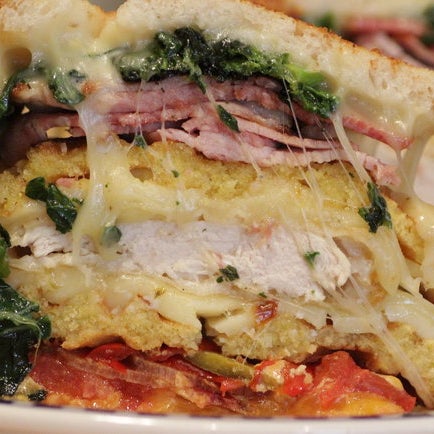 Pullman Kitchen just unleashed its biggest, baddest "grilled cheese" of all time: "The Beast of Midtown East". It's a 13-layers with fried chicken, ham, bacon, and all kinds of other excellent stuff.