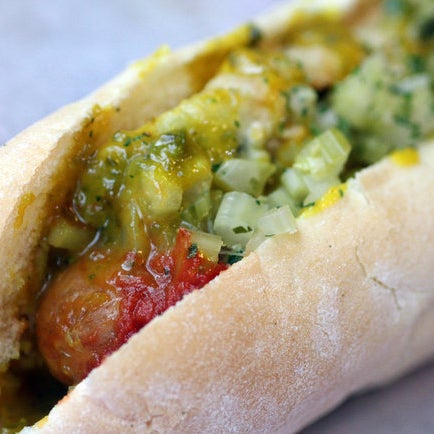 The Modern Chicago Hot replaces traditional Chicago hot dog ingredients with tomato jam, a deep-fried pickle spear, jalapeño mustard, and pickled celery.