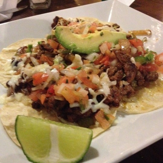 Photo taken at Cilantro&#39;s Grill &amp; Cantina by Arnoldo G. on 12/15/2012