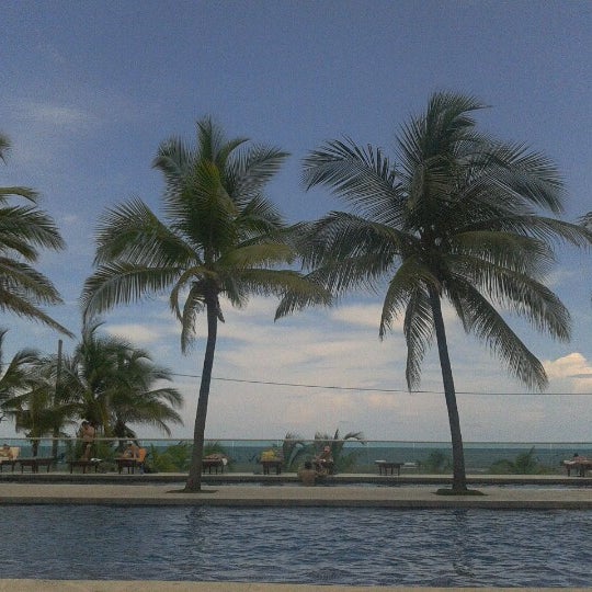 Photo taken at Playa Las Américas by Giovanni H. on 10/6/2012