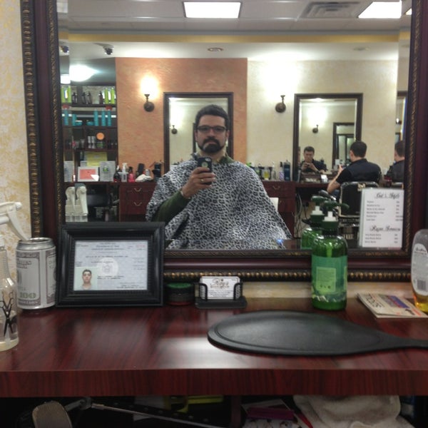 Photo taken at Ray&#39;s Barber Shop by Persio L. on 3/2/2013