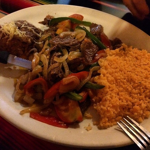 Photo taken at Tecalitlan Restaurant by Oscar L. on 5/27/2014