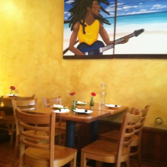 Photo taken at Island Soul Caribbean Bar and Cuisine by Carol A. on 12/11/2012