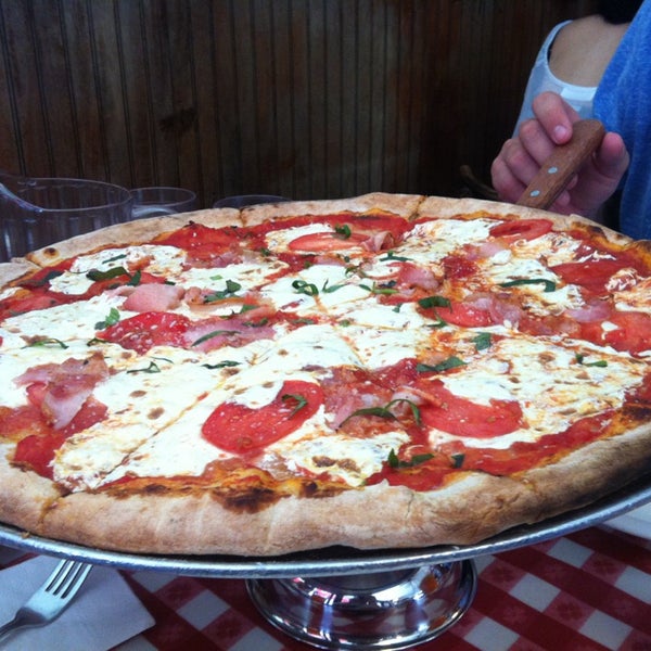 Photo taken at Lombardi&#39;s Coal Oven Pizza by Mike P. on 6/30/2013