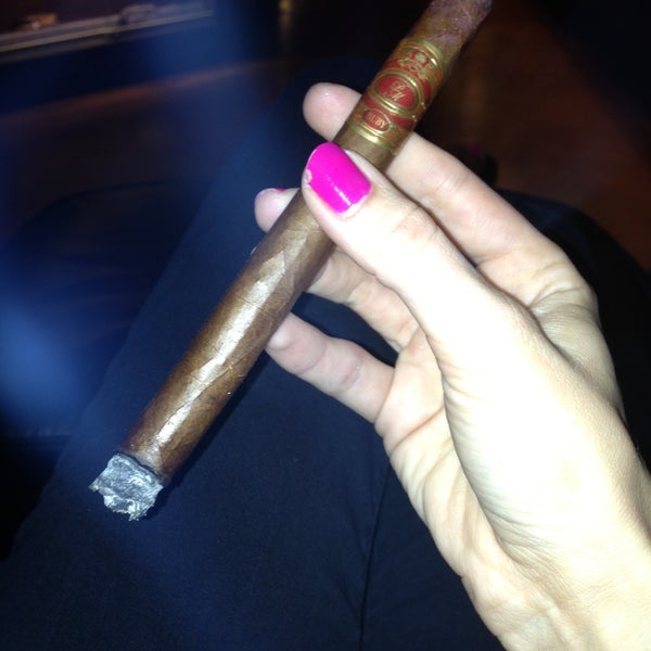Photo taken at Burns Tobacconist Downtown by Erin on 4/16/2013