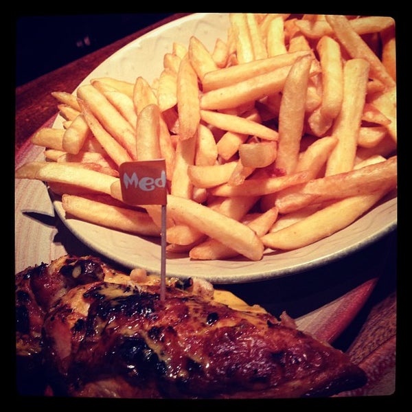 Photo taken at Nando&#39;s by Ghida A. on 2/6/2013