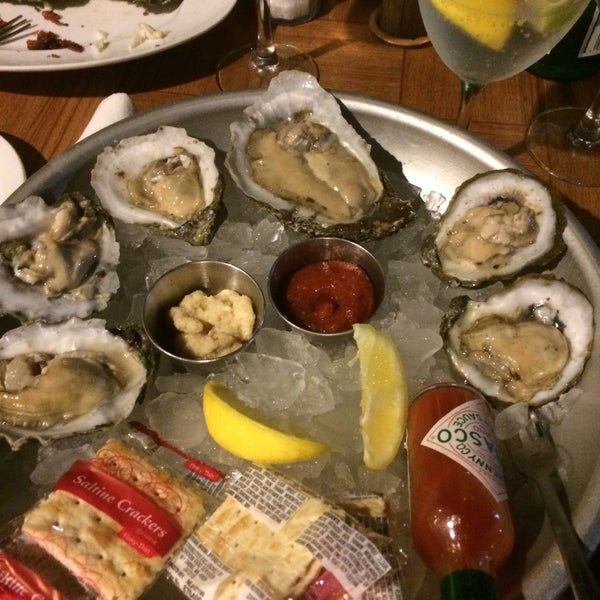 Photo taken at Fish Tale Grill by Merrick Seafood by Christoph M. on 3/21/2015