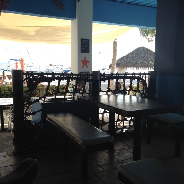 Photo taken at Kaibo restaurant . beach bar . marina by Fernando A. on 4/1/2014