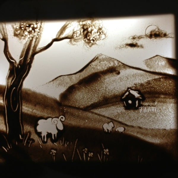 Рисование песком картины