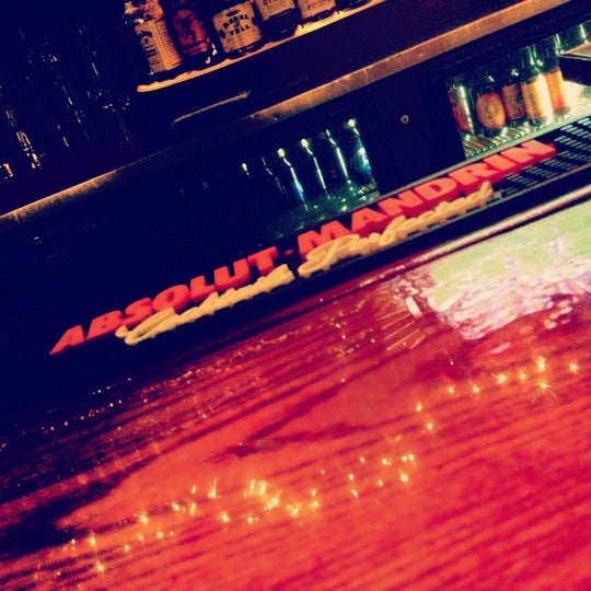 Photo taken at Rebel Bar &amp; Grill by Natalie J. on 11/21/2012