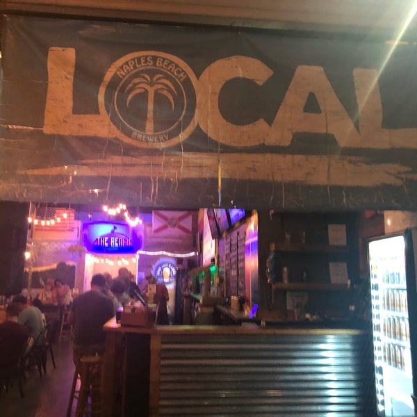 Photo taken at Naples Beach Brewery by Ross S. on 3/9/2019