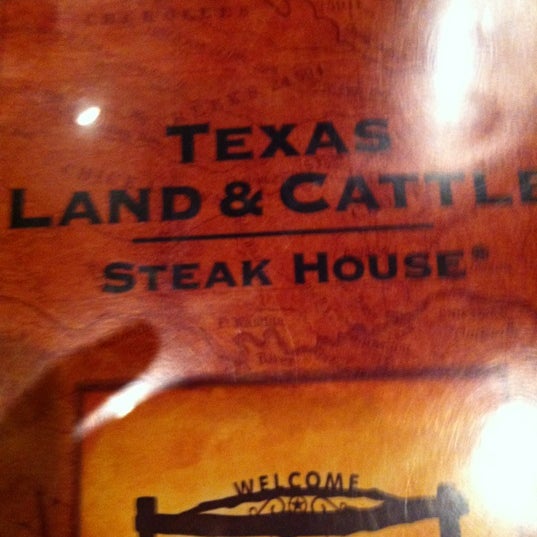 Photo taken at Texas Land &amp; Cattle by Lisa M. on 11/28/2012