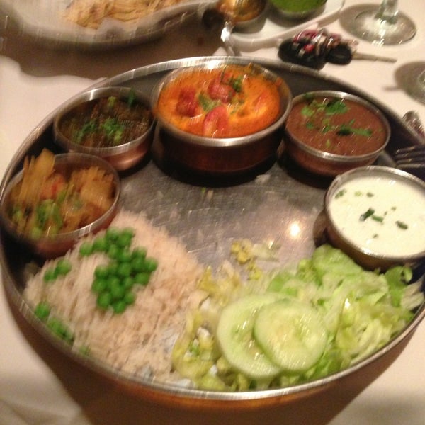 Photo taken at Akbar Indian Restaurant by Greg P. on 1/12/2013