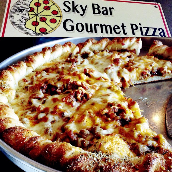 Photo taken at Sky Bar Gourmet Pizzeria by Anna S. on 10/4/2015