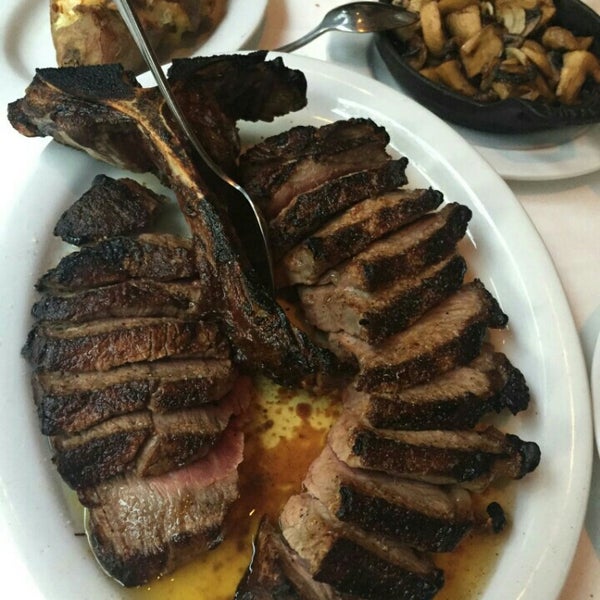 Photo taken at Dino &amp; Harrys Steakhouse by Carly C. on 6/11/2015