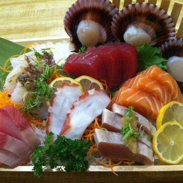 Photo taken at Sushi Ichimoto by Erica C. on 6/12/2013