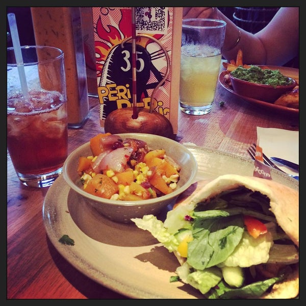 Photo taken at Nando&#39;s by Laura P. on 7/4/2015