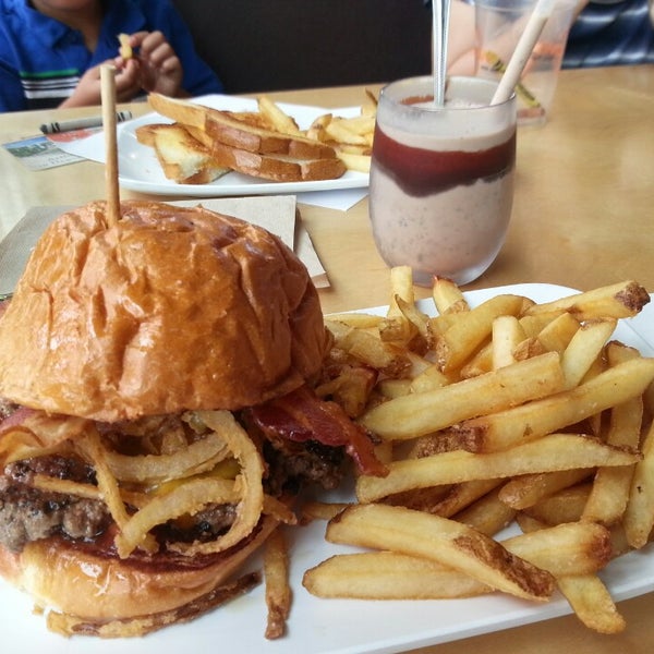 Photo taken at Crave Real Burgers by Michael on 7/7/2013