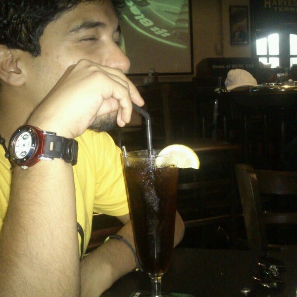 Photo taken at Harvester&#39;s Traditional Pub by Imad E. on 6/29/2013