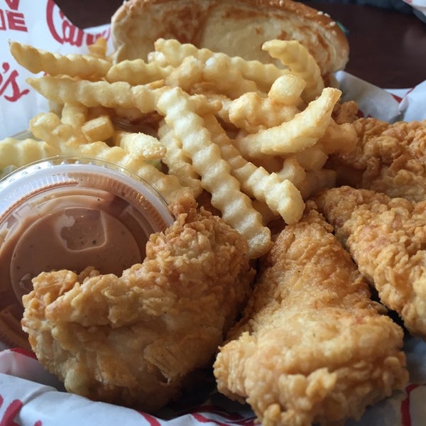 Photo taken at Raising Cane&#39;s Chicken Fingers by Drew W. on 2/27/2015