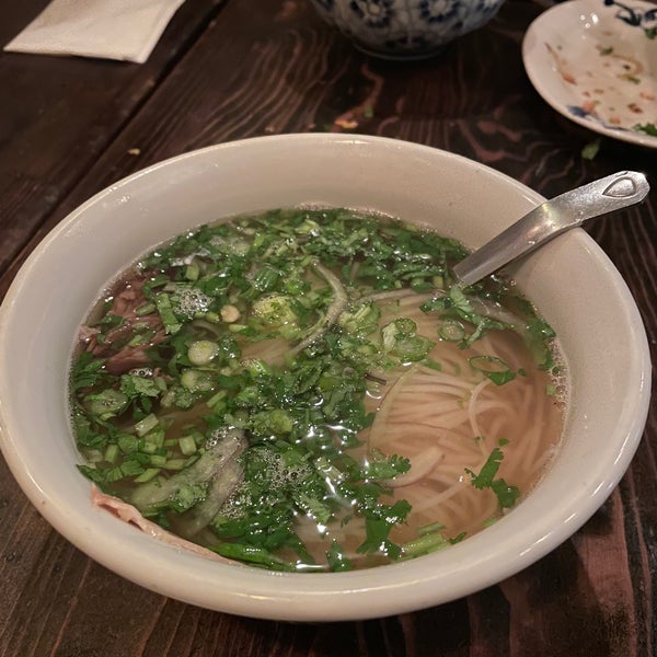 Amazing food! Interesting that they serve pho with ginger and their house chili oil. I recommend the papaya and pig ear salad and the pho with bone broth