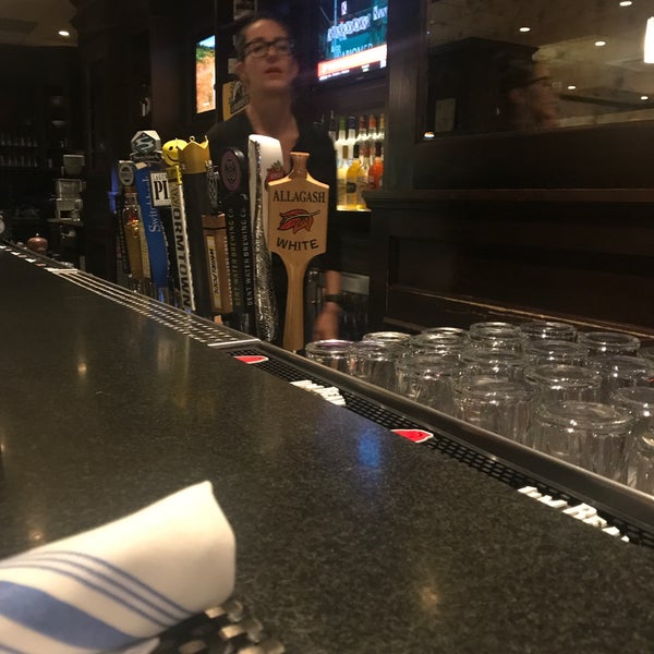 Photo taken at Slate Bar &amp; Grill by Eric A. on 5/15/2019