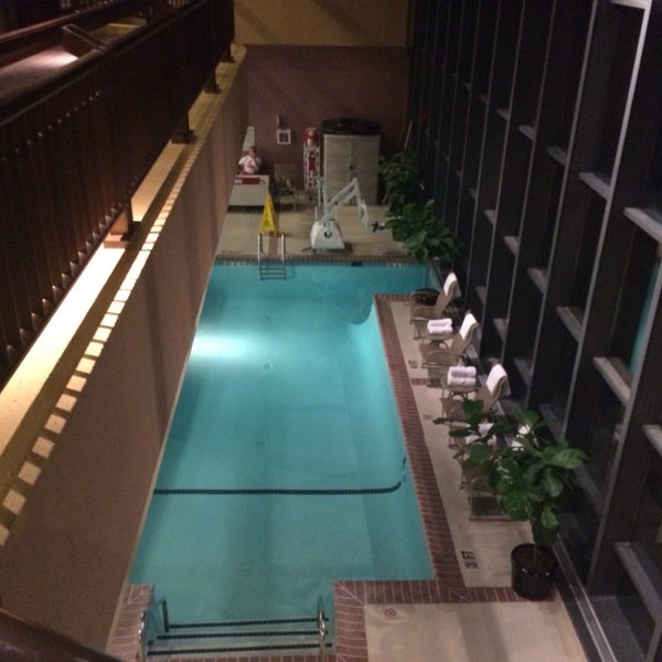 The pool is one level down from the lobby — but is open to the walkway from the parking garage