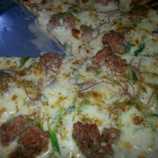 Photo taken at Saucy Pizzeria by Nahara A. on 11/9/2012
