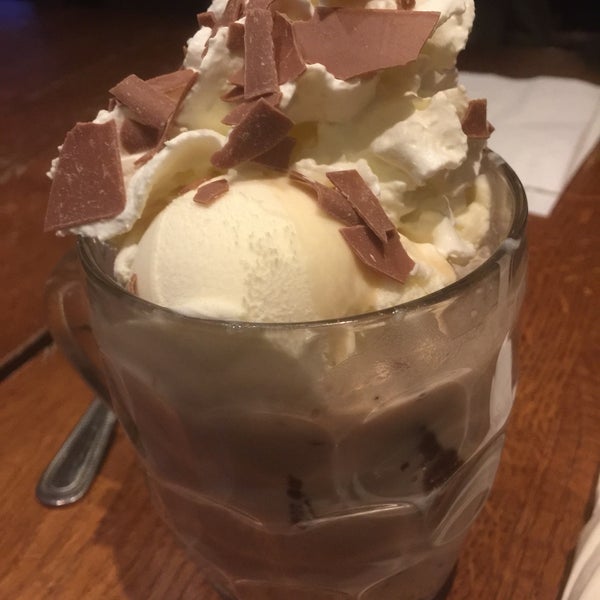 Strangest desert ever, sold as a sundae: ice cream, chocolate brownie and sauce, but in a pint mug with 1/2 pint of milk🥛